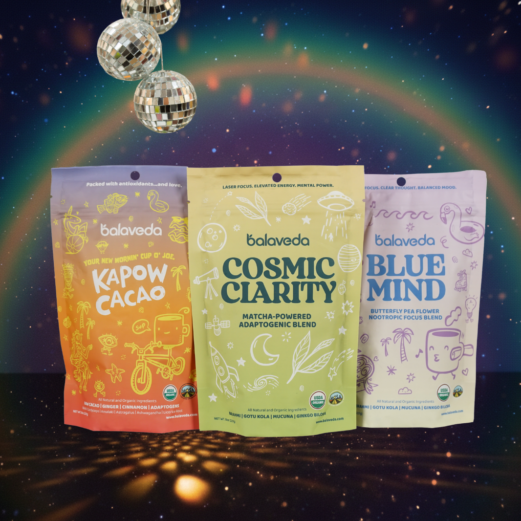 Three Balaveda nootropic powders packages labeled 'Kapow Cacao', 'Cosmic Clarity', and 'Blue Mind' against a cosmic background with disco balls.